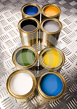 Paint and gold cans