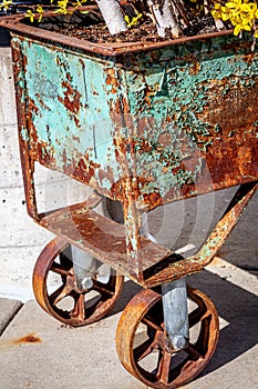 Paint pealing off an old rolling bin.