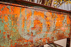 Paint pealing off an old rolling bin.