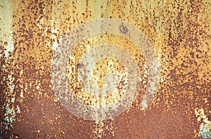 Paint peeling crackling off brown rusty metal texture background.