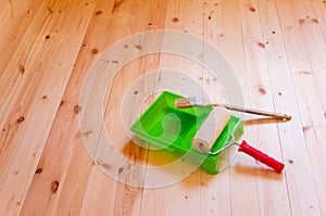 Paint roller brush on wood background