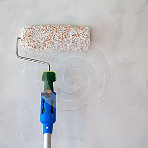 Paint roller for painting wall after plastering