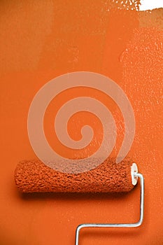 Paint Roller on White Wall