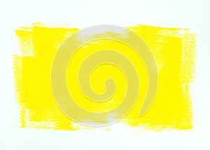 Paint roller yellow strokes on white wall