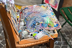 Paint strokes on the artist`s palette. Oil paints