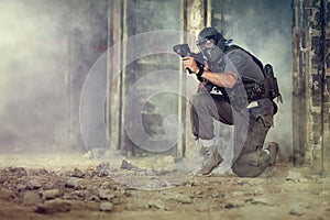 Paintball player shooting