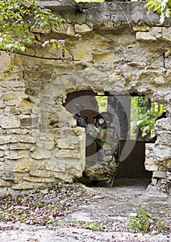 Paintball girl shooting from wrecked house