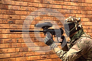 Paintball player aiming the gun