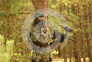 Paintball player in forest