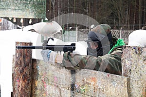 Paintball player with a gun