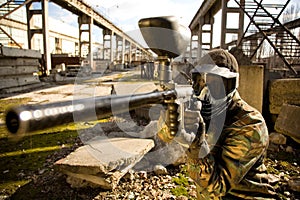 Paintball player with gun