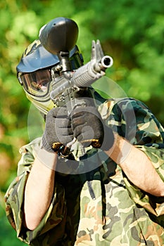 Paintball player holding fire