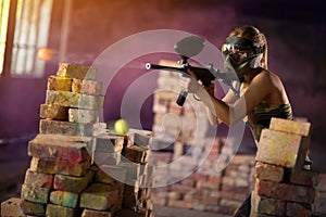 Paintball player in mid game