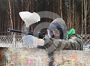 Paintball player in shooting