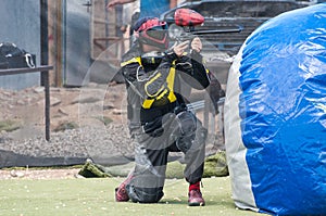 Paintball player shooting