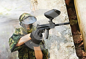 Paintball player under cover