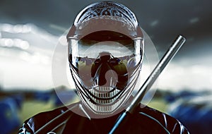 Paintball player wearing a mask with reflection photo