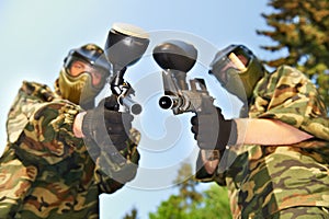 Paintball players with guns photo