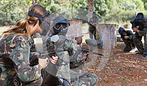 Paintball players of opposite teams in shootout