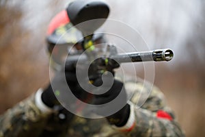 Paintball sport player wearing protective mask