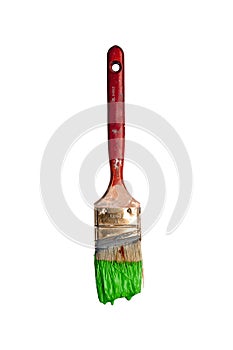 Paintbrush dripping green paint