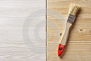 Paintbrush on Painted Wooden background