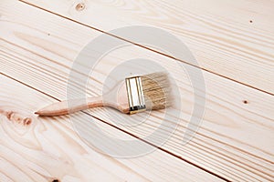 Paintbrush on wooden surface