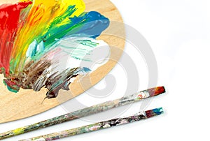 Paintbrushes and colors on palet