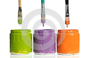 Paintbrushes Dripping Paint into Containers