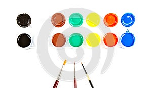 Paintbrushes and paint .