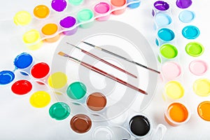 Paintbrushes and paint .