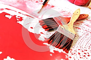 Paintbrushes and the red colour