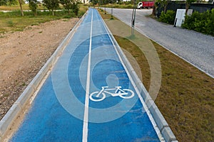 Painted bicycle icon on an asphalt road