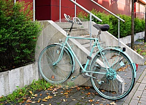 Painted bicycle locked to railing
