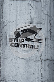 Painted by CCTV camera on a concrete wall