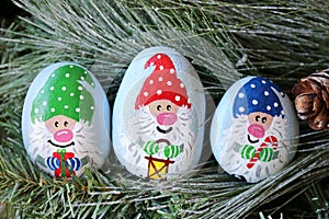 Painted Christmas Gnome Kindness Rocks on Evergreen Tree Branch