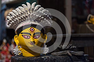 Painted and colorful face of Goddess Durga.