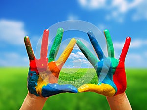 Painted colorful hands showing way to clear happy life