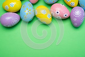 Painted Easter eggs on a colorful background