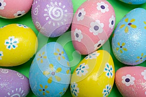 Painted Easter eggs on a colorful background