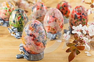 Painted Easter eggs in custom egg holders