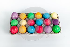 Painted Easter eggs in egg box