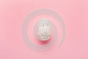 Painted egg on pink background. Easter holiday concept