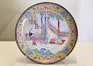 Painted enamel round plate from Qing Dynasty in Forbidden City, Beijing