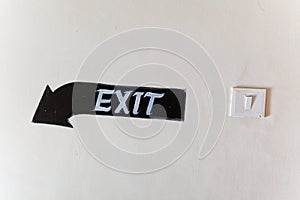 Painted exit sign on wall