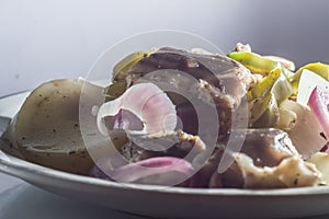 painted fish and catfish on a plate with vegetables and seasoning, selective focus and copy space " Siluriformes"