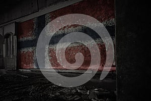 Painted flag of norway on the dirty old wall in an abandoned ruined house