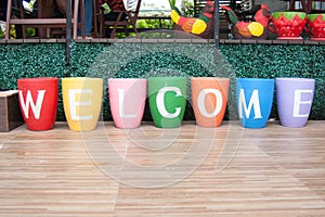 Painted Flower Pots Spell Welcome