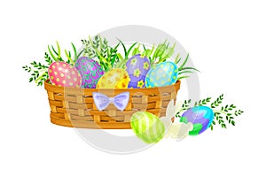 Painted or Foiled Easter Eggs or Paschal Eggs Rested in Wicker Basket in Green Grass Vector Illustration