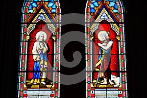 Painted glasses of saints in church .